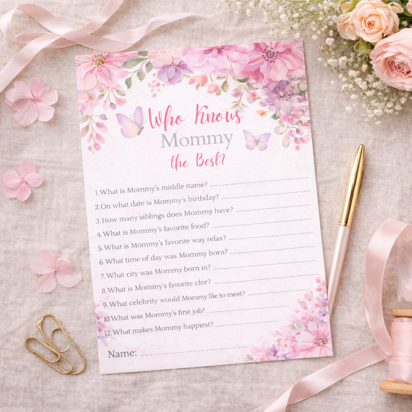 Floral-themed baby shower game card titled 'Who Knows Mommy the Best?' on a decorative background with flowers and ribbons.