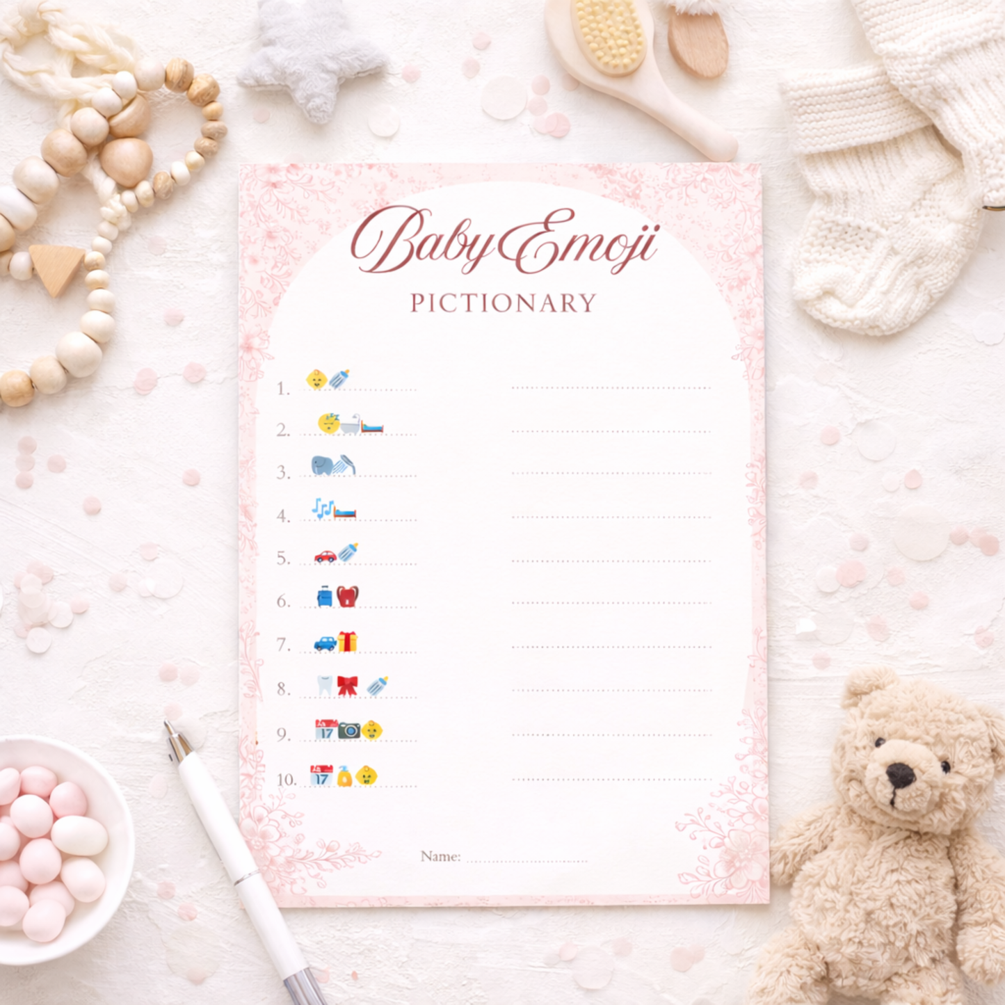 Baby-themed emoji dictionary with toys and stationery on a light background