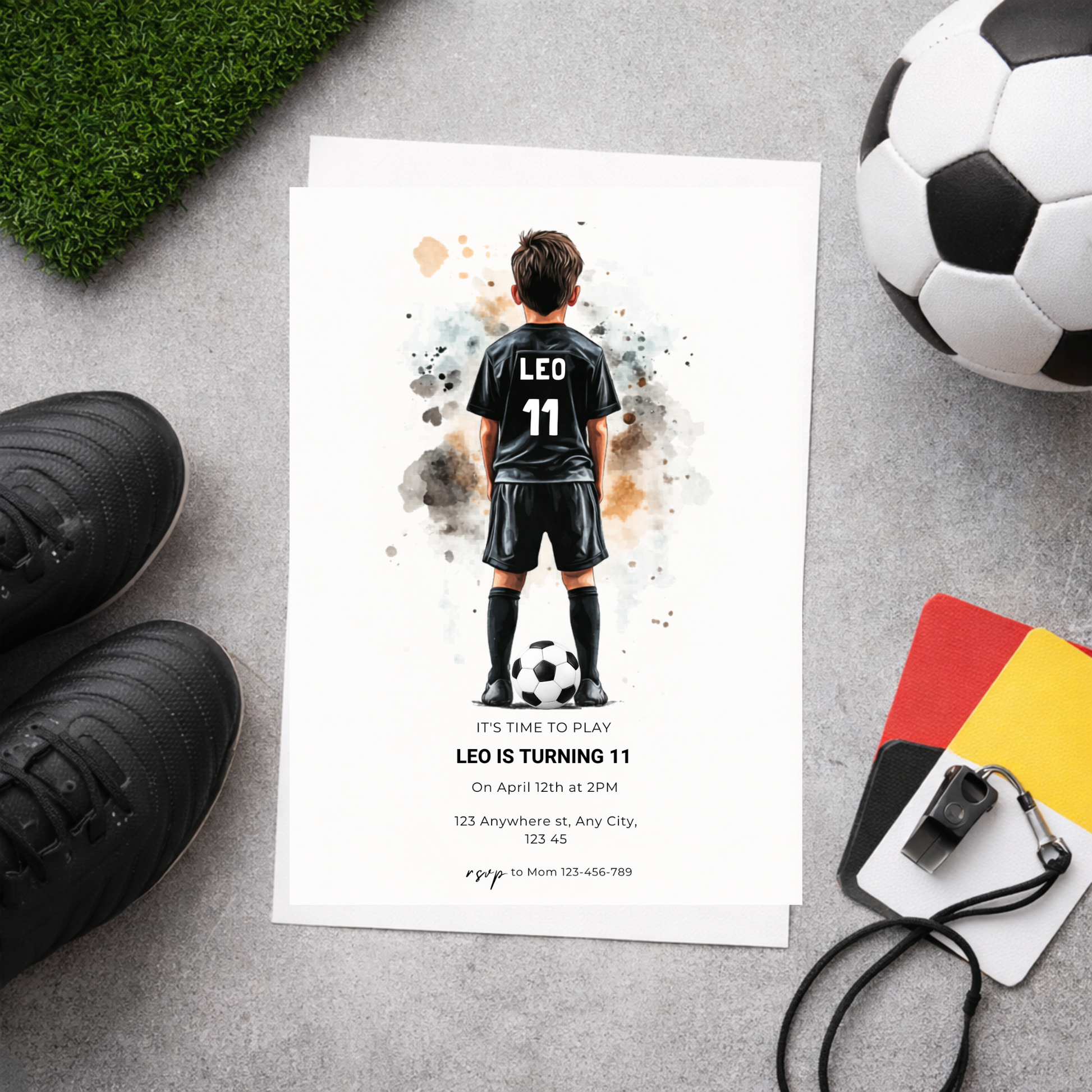 Soccer-themed birthday invitation with a child in a soccer uniform, surrounded by soccer equipment on a gray surface.
