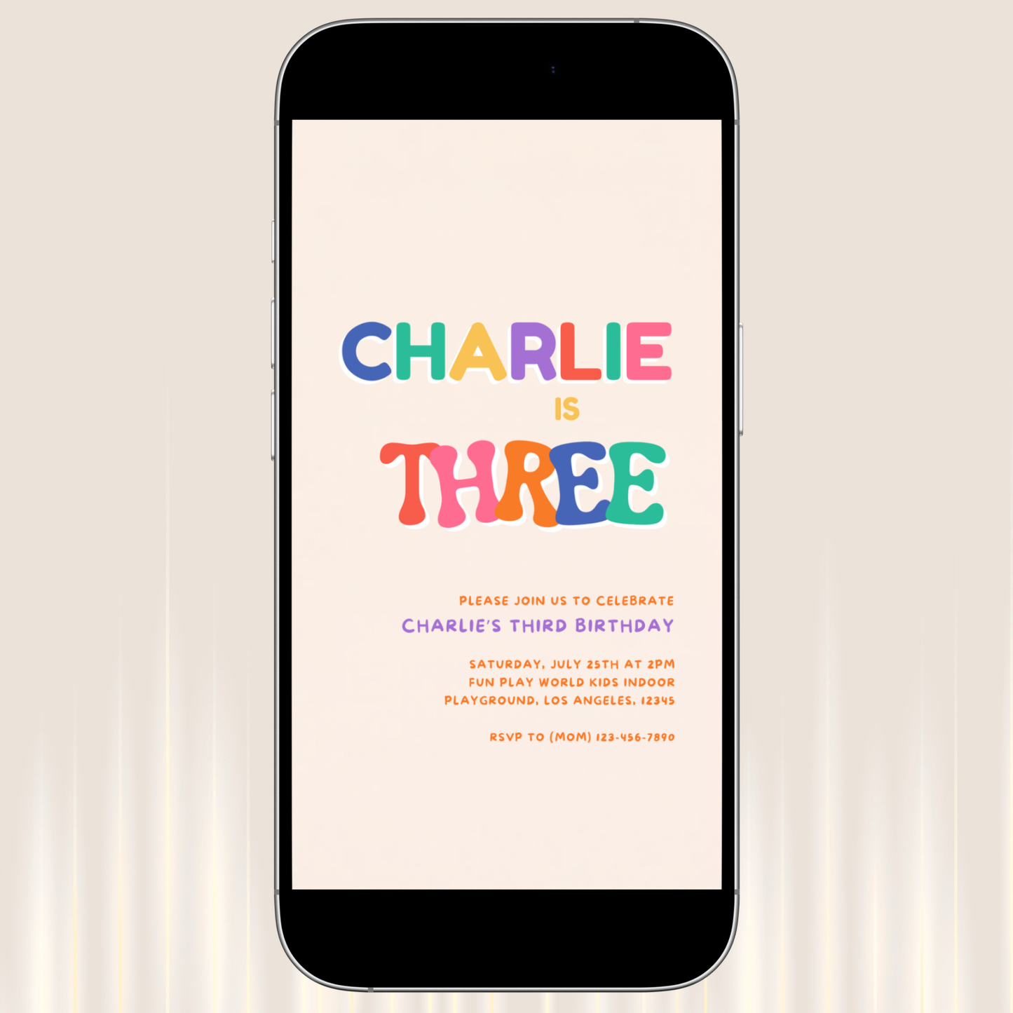 Phone displaying a colorful birthday invitation with 'Charlie is Three' on a light background