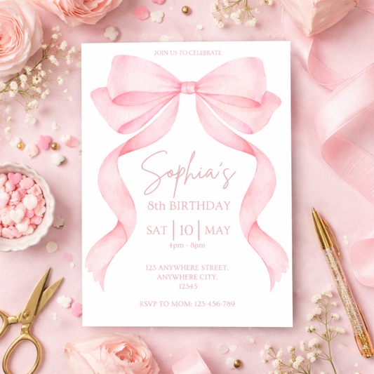 Birthday invitation card with pink bow on a decorative background with flowers and stationery.