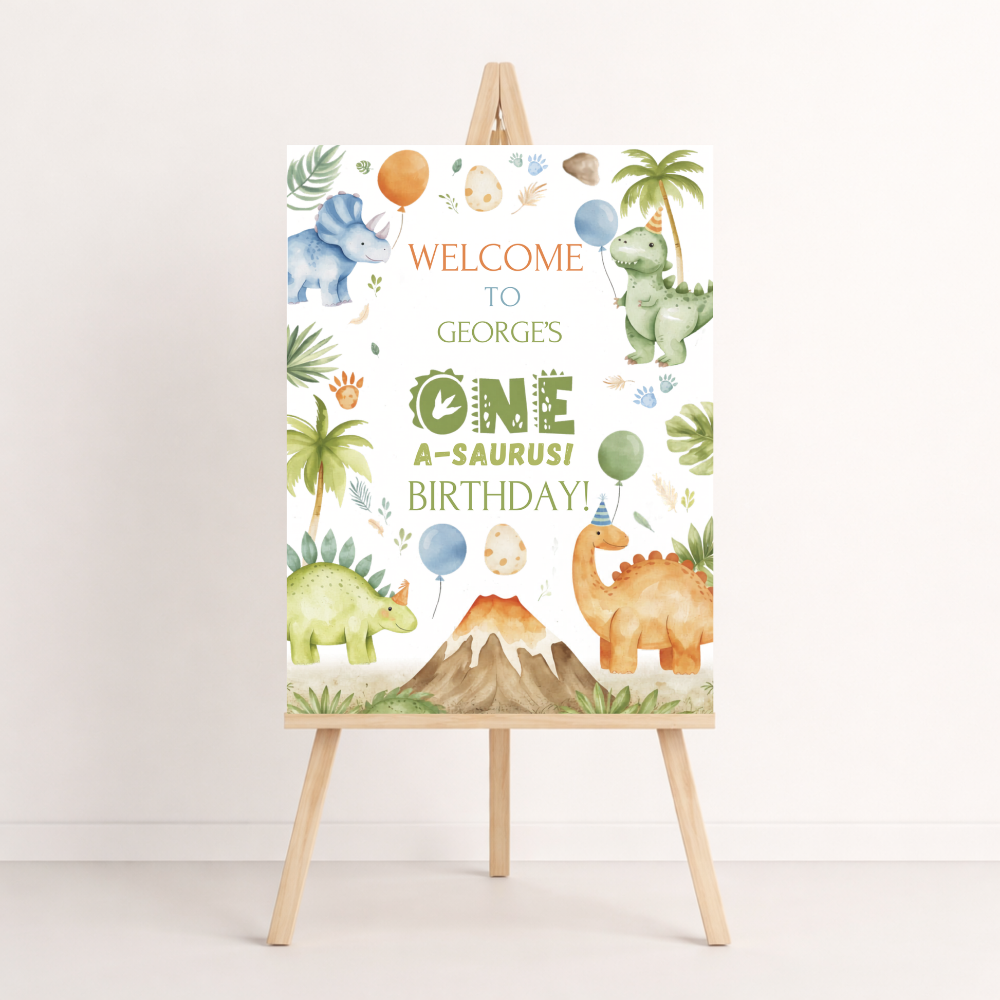 Dinosaur-themed birthday welcome sign on an easel with colorful balloons and mountain design.