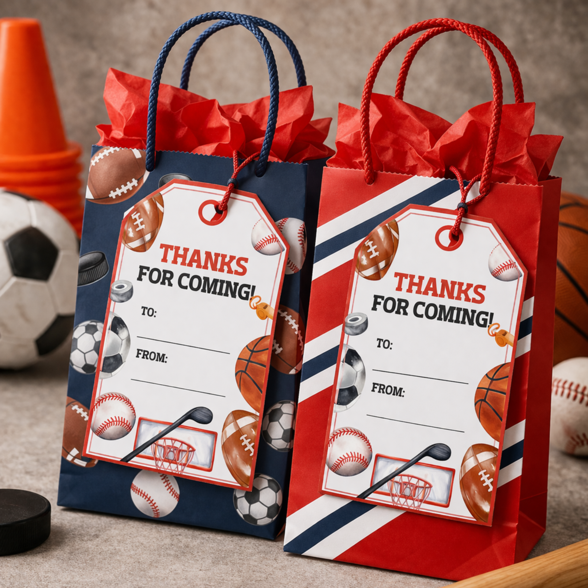 Two gift bags with sports-themed tags and accessories on a gray surface.