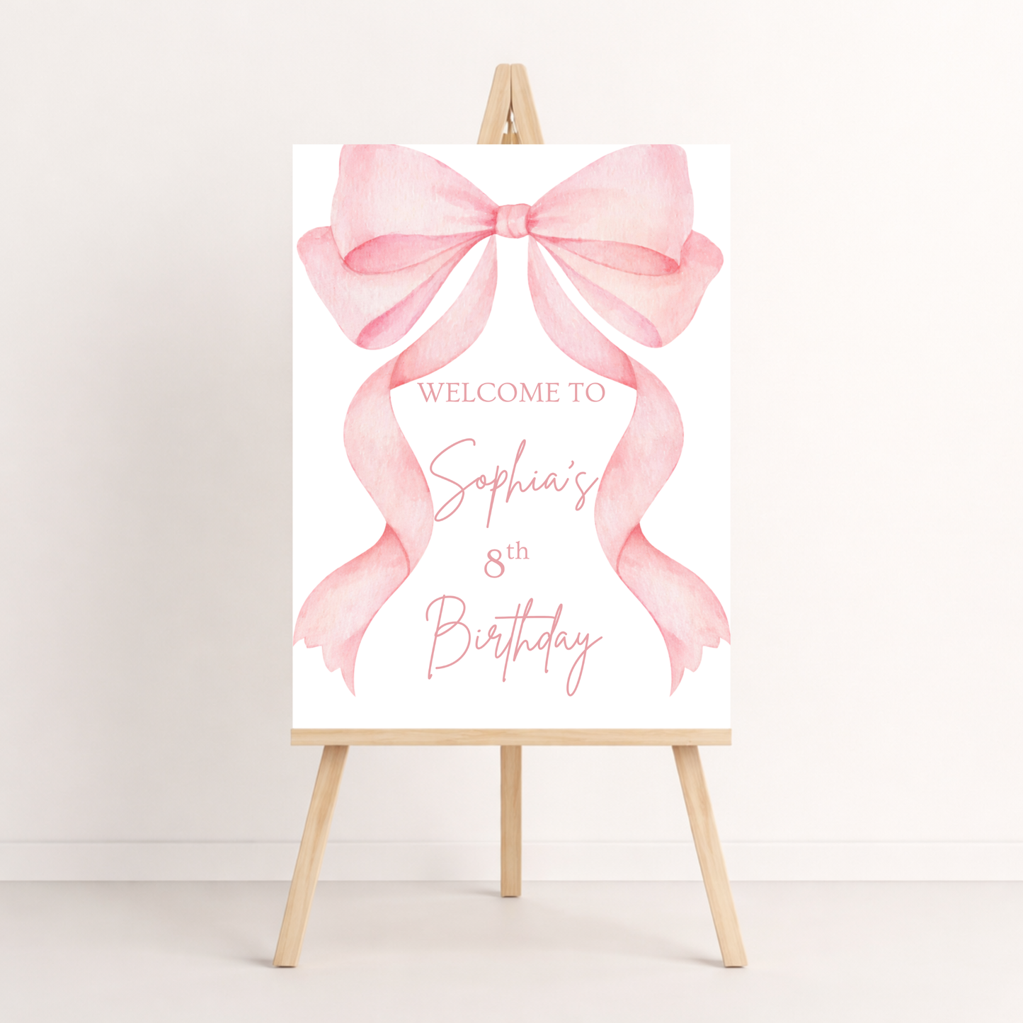 Birthday welcome sign with pink bow on a white background