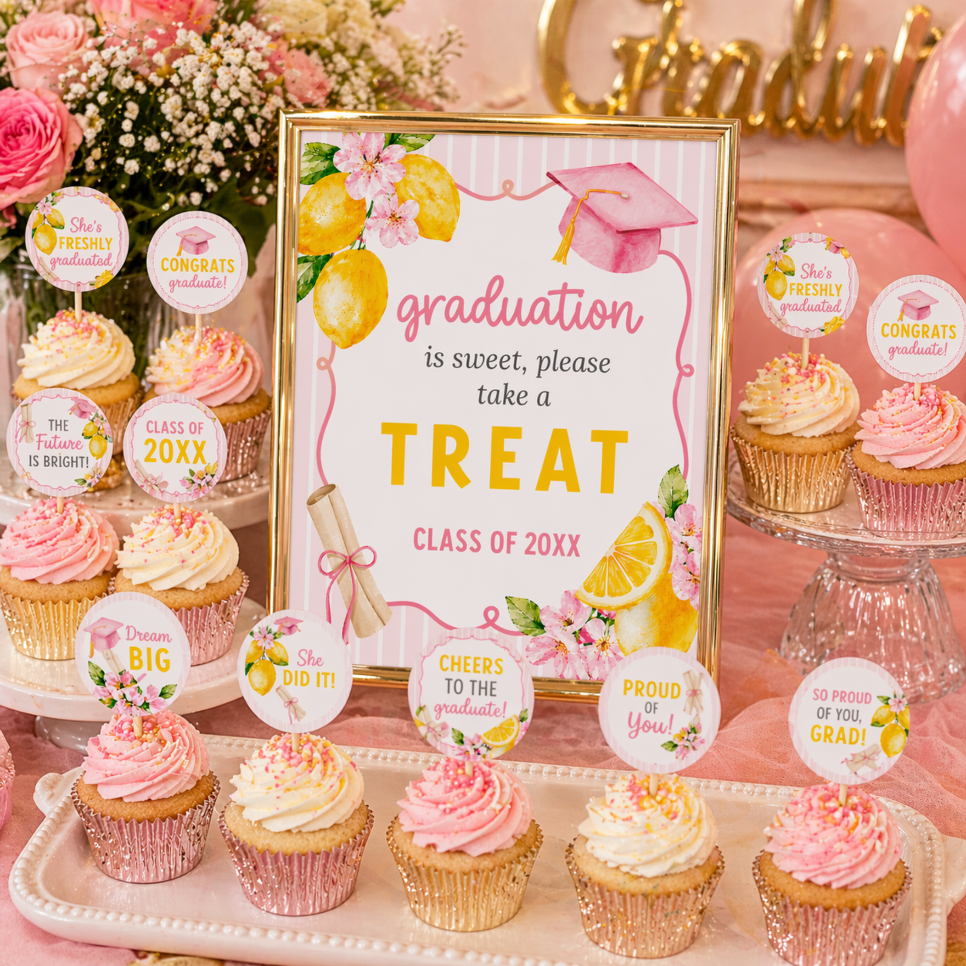 Graduation-themed dessert table with cupcakes and decorative signs.