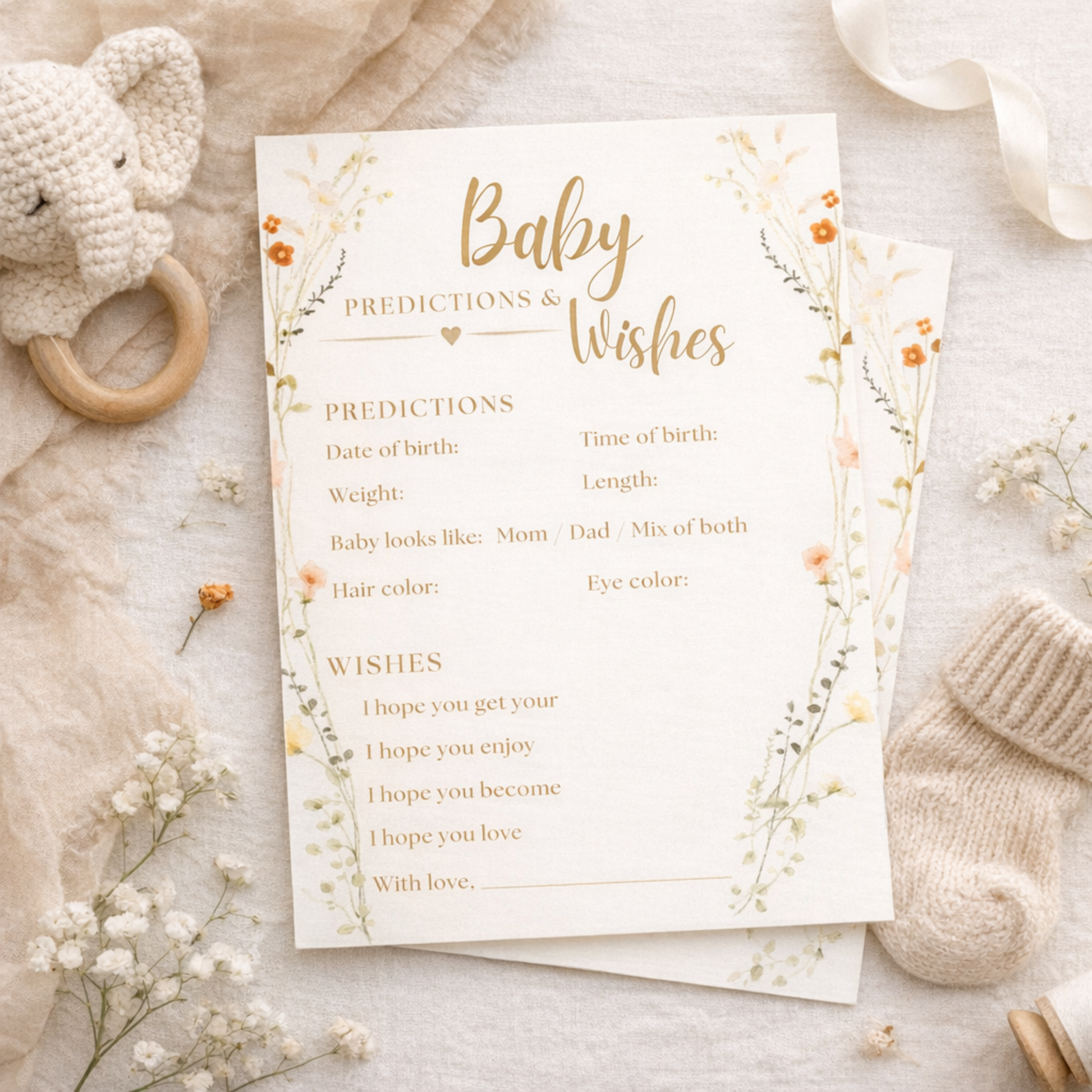 Baby predictions and wishes card with floral design on a soft background with baby items.