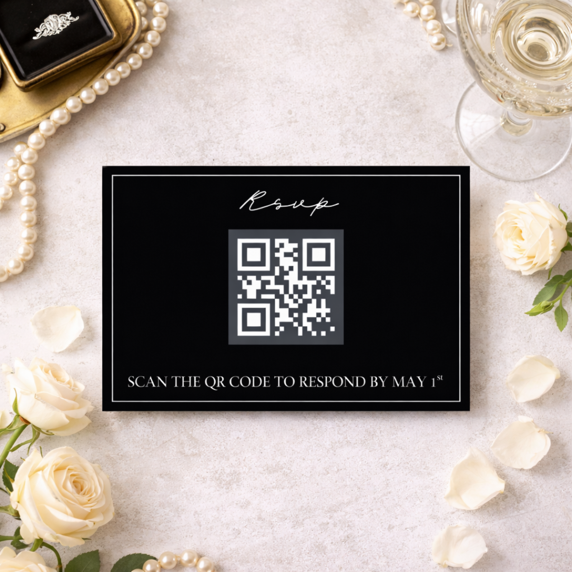 QR code invitation card with wedding accessories on a marble surface