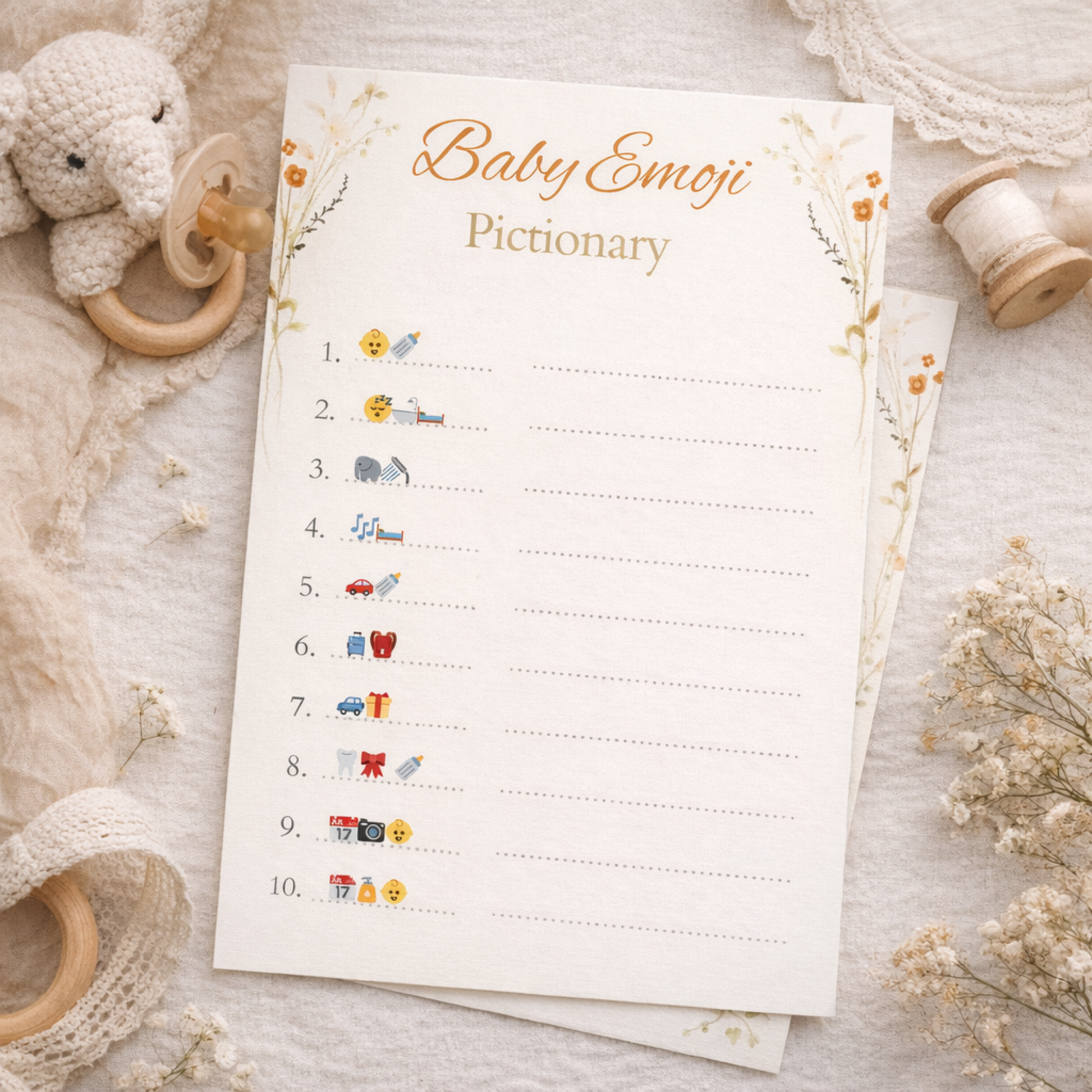 Baby emoji dictionary on a soft surface with toys and flowers